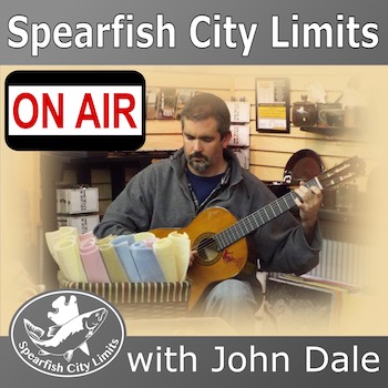 SCL show art - John playing guitar at an art show